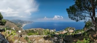 A panoramic view of the Isla Isabel coastline with lush greenery meeting the ocean.