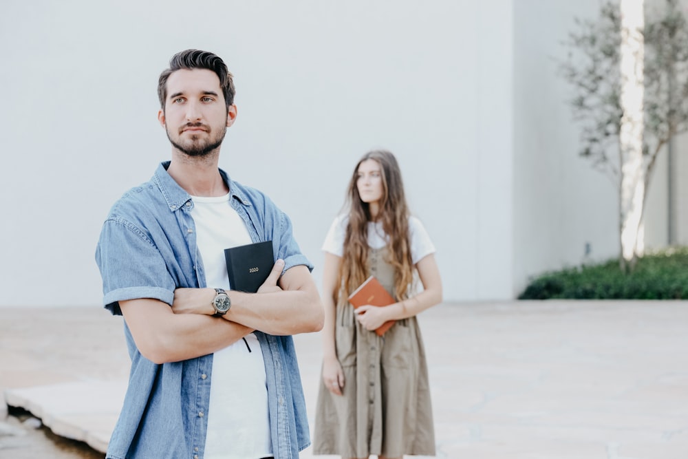 man and woman standing near wall