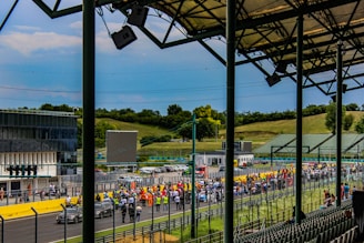 A scenic view of a racing event with spectators cheering.