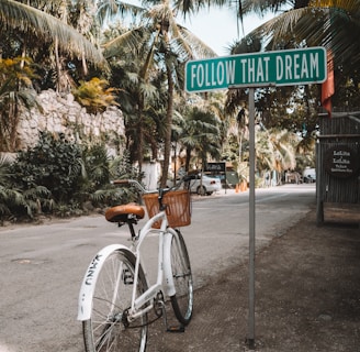 parked white bicycle