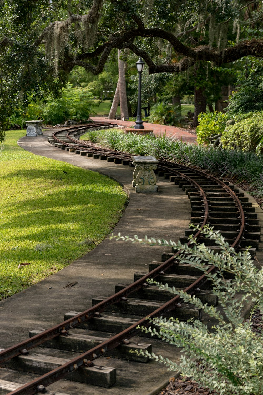 black train railway at daytime close-up photography