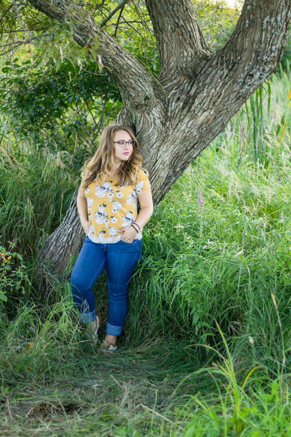 woman wearing yellow and white floral shirt