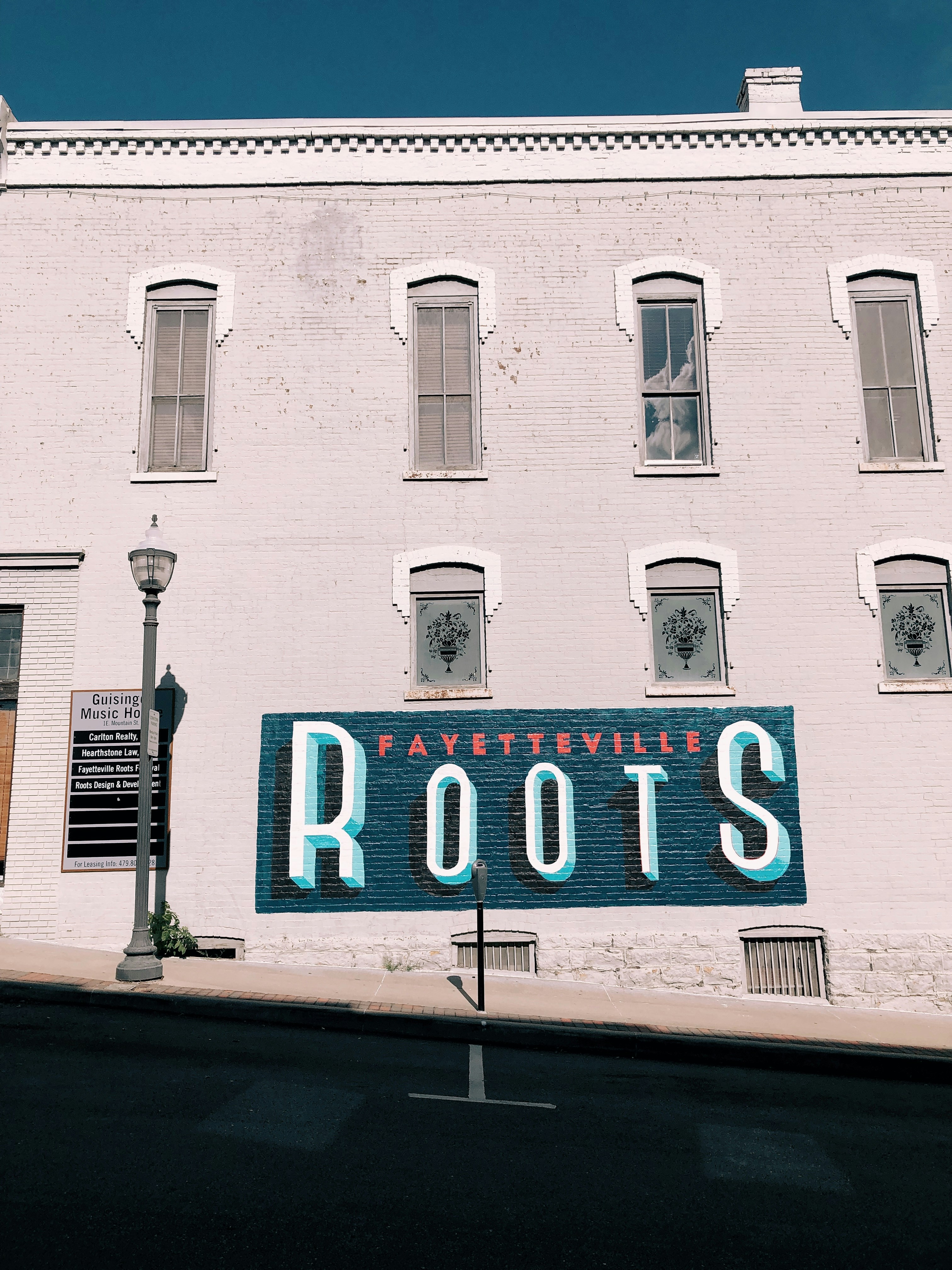 gray street lamp beside building