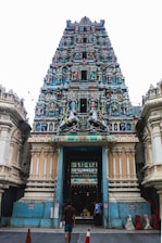Front entrance of Seetha Rama Alayam temple with intricate traditional carvings and vibrant decorations.