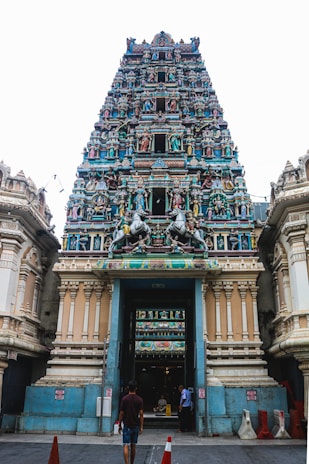 Front entrance of Seetha Rama Alayam temple with intricate traditional carvings and vibrant decorations.