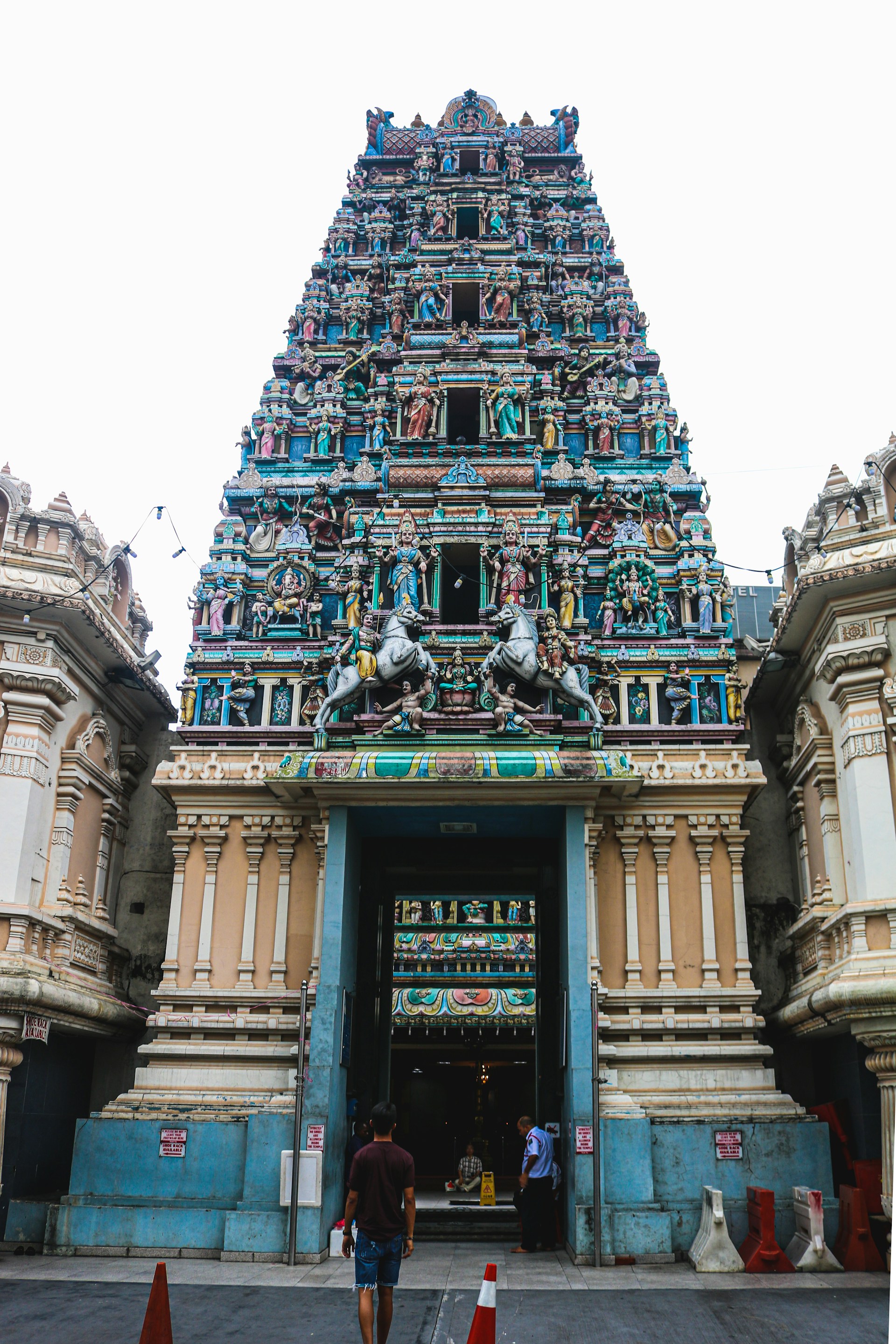woman wearing yellow long-sleeved dress under white clouds and blue sky during daytime