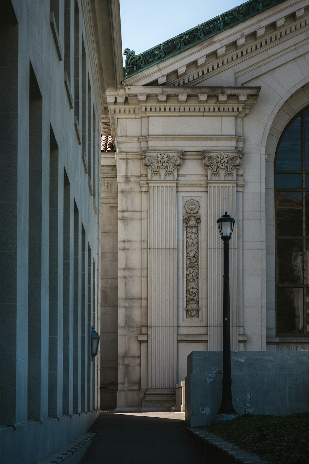 black street lamp beside white column