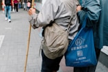 a couple of people walking down a street