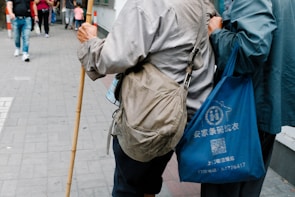 a couple of people walking down a street