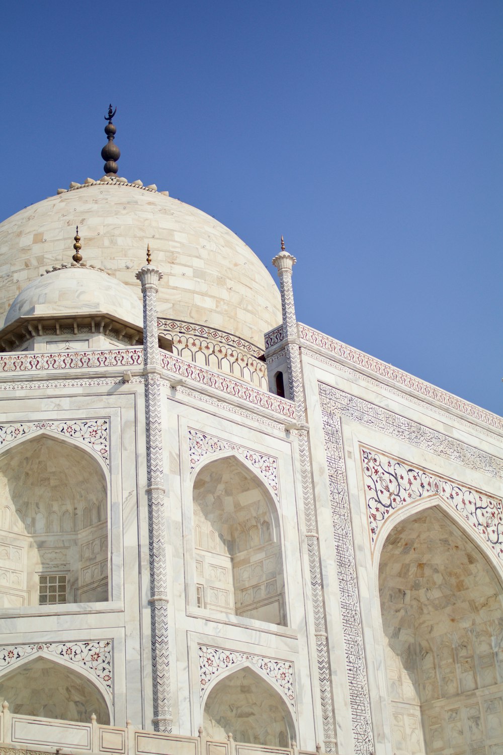 beige concrete dome building under blue sky