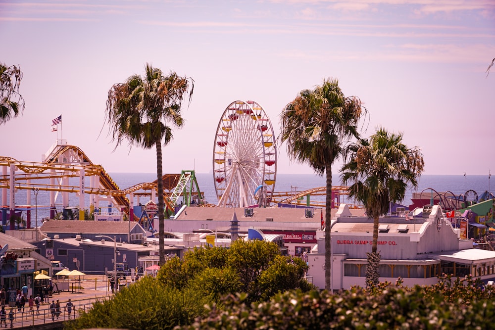 aerial photo of Ferris Wheel beside sea