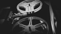 a black and white photo of a movie projector