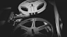 a black and white photo of a movie projector