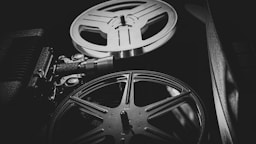 a black and white photo of a movie projector