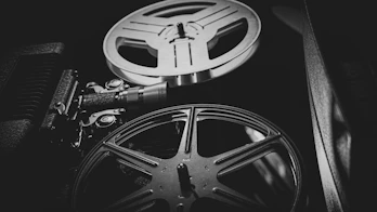a black and white photo of a movie projector