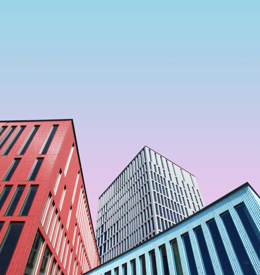 three multicolored buildings