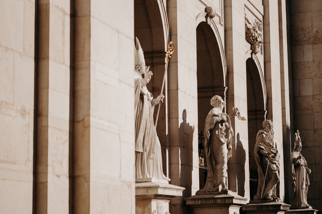 shallow focus photo of four statues