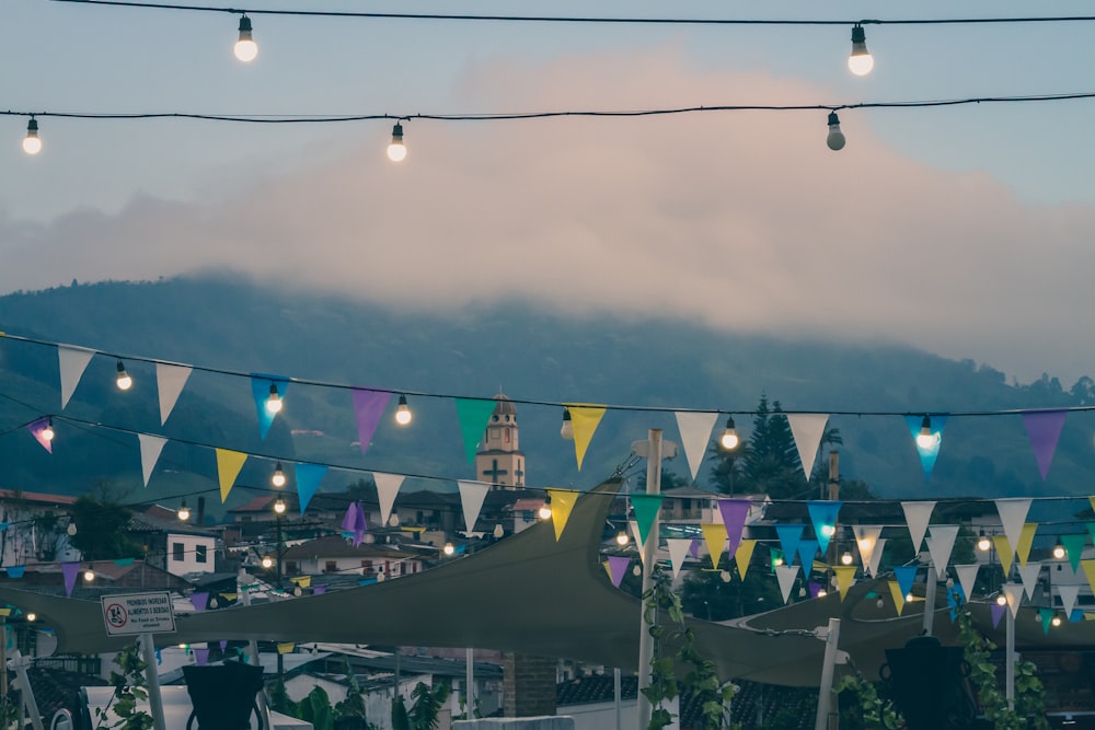 assorted-color buntings under white clouds