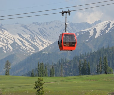 red cable car on focus photography