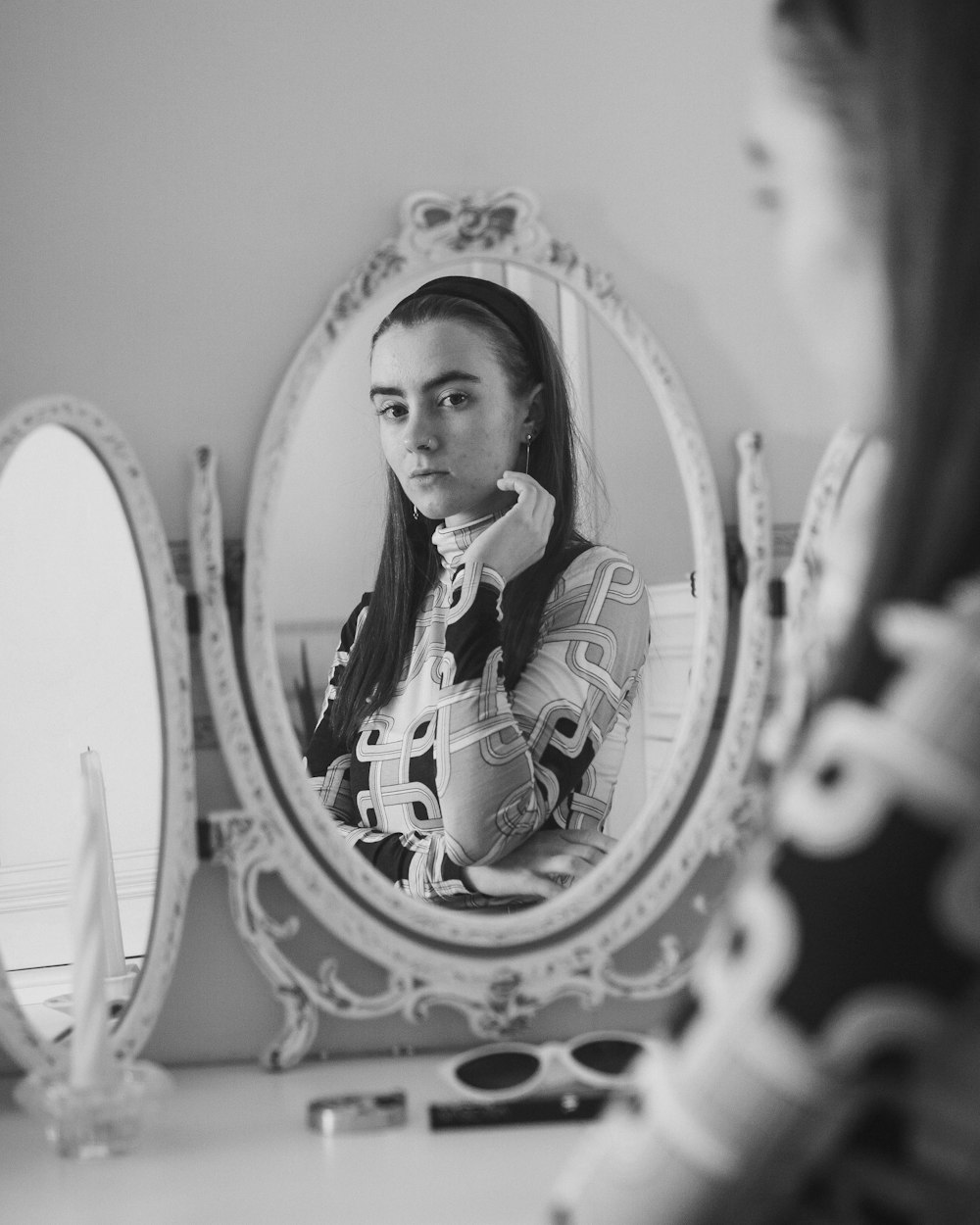 woman in front of mirror