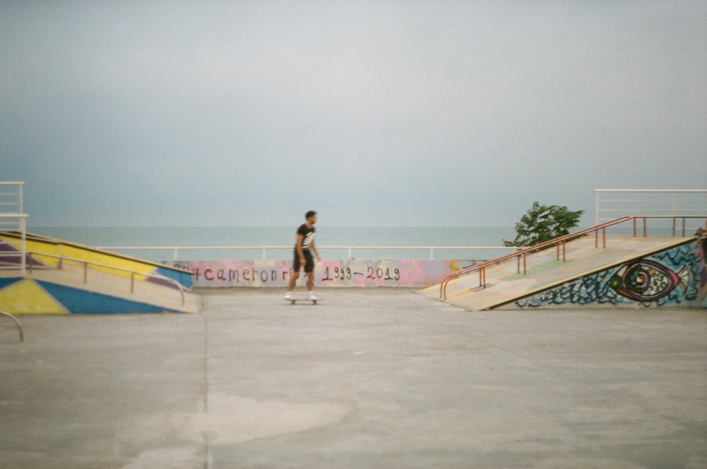 a man riding a skateboard down the side of a ramp