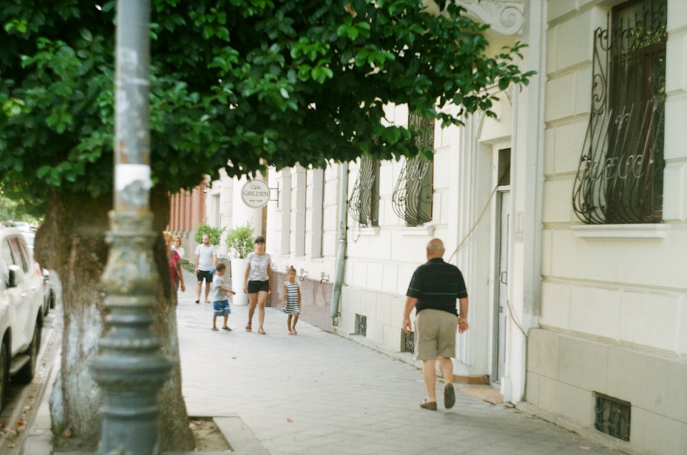 man walking on sidewalk