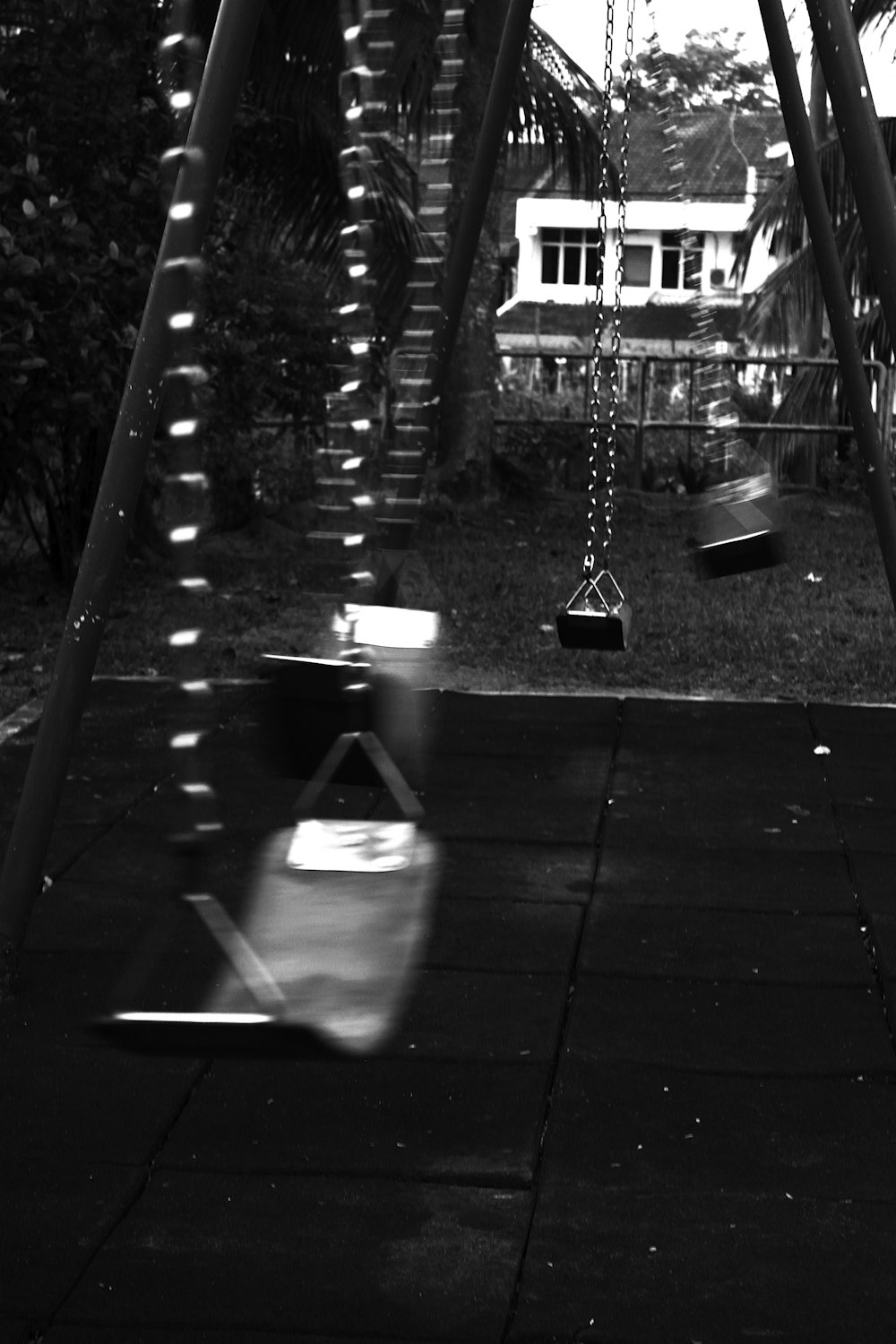 grayscale photo of swing