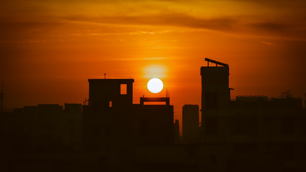 silhouette view of buildings during golden hour