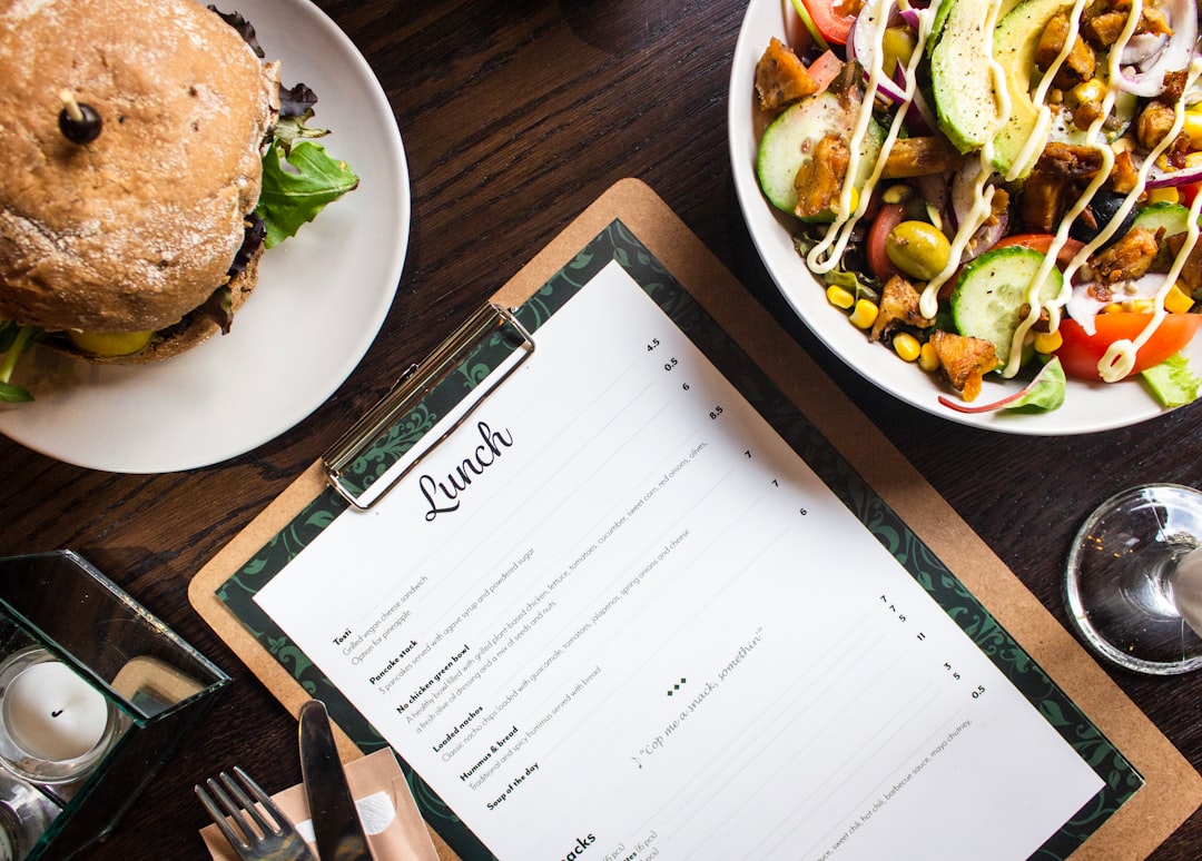 foods and clipboard on brown table