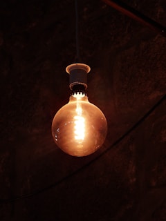 A bright LED light bulb glowing in a modern setting.
