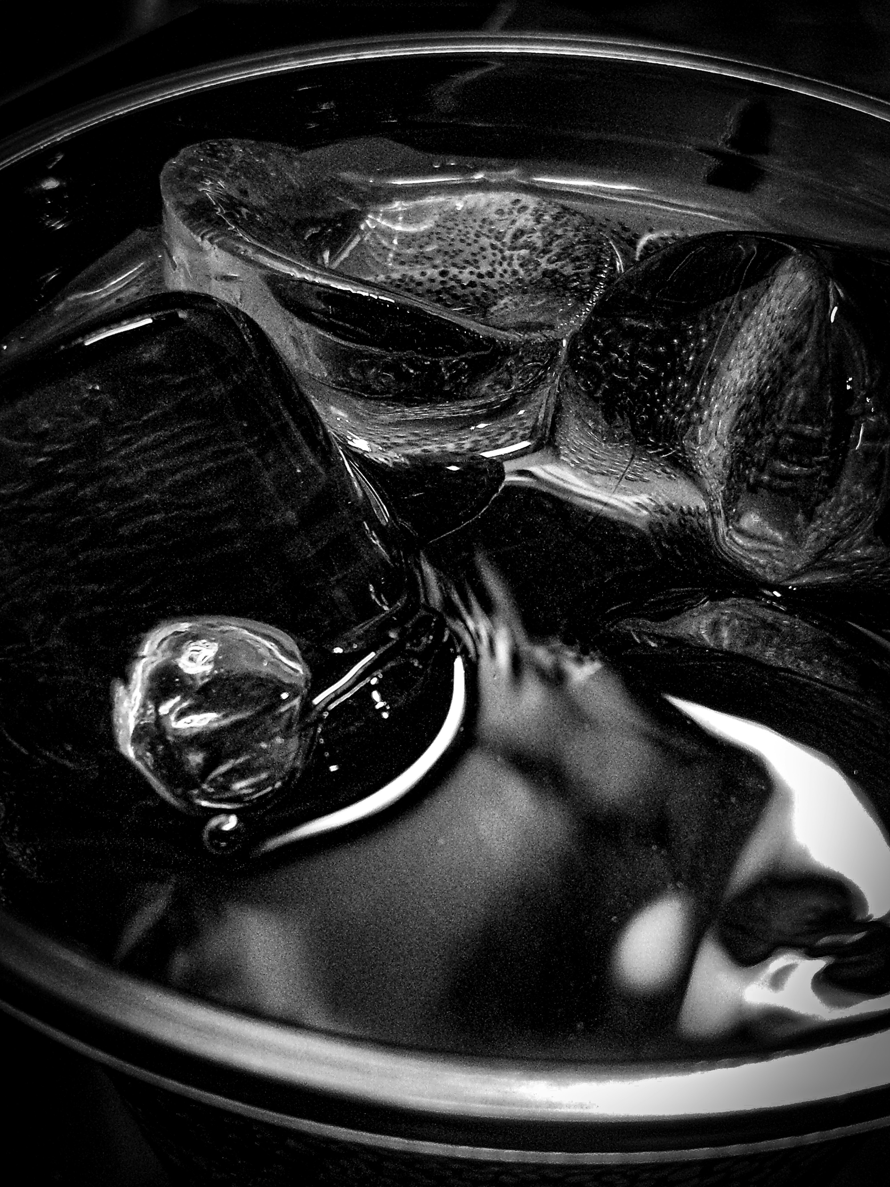 Ice cubes in a bowl of water on a table