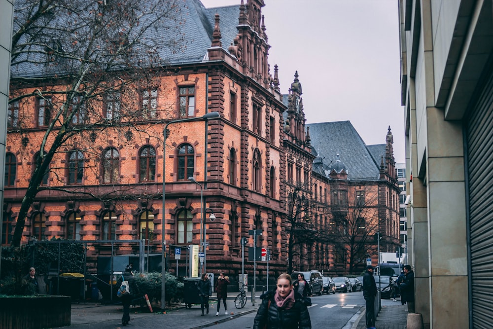 people on road near buildings