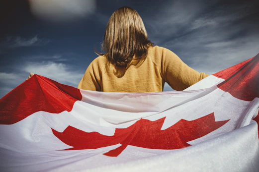 woman holding Canada flag