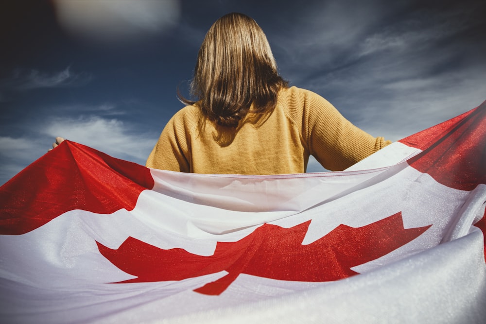 woman holding Canada flag