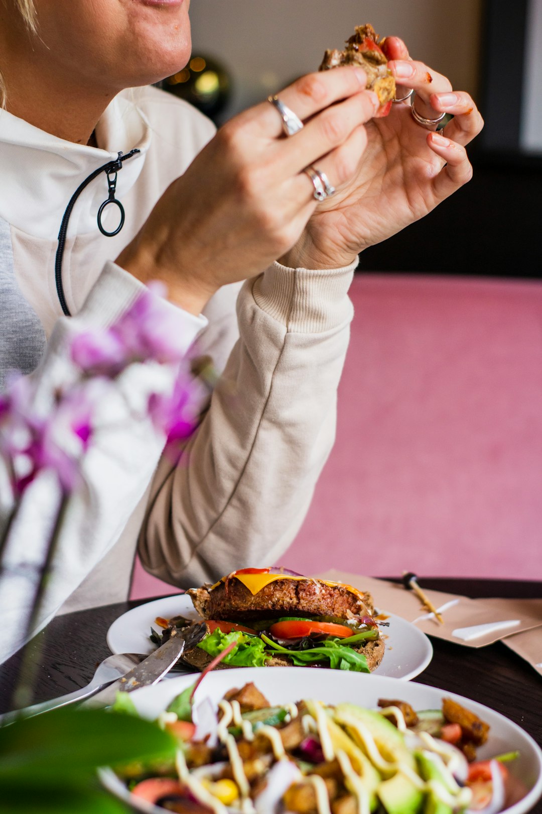 plate of burger and stir-fried vegetables