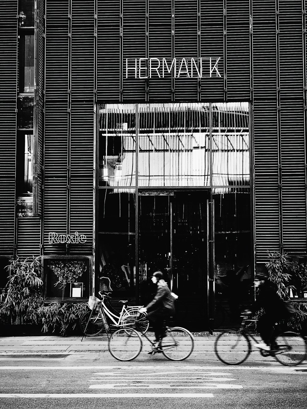 grayscale photography of Herman K shop front