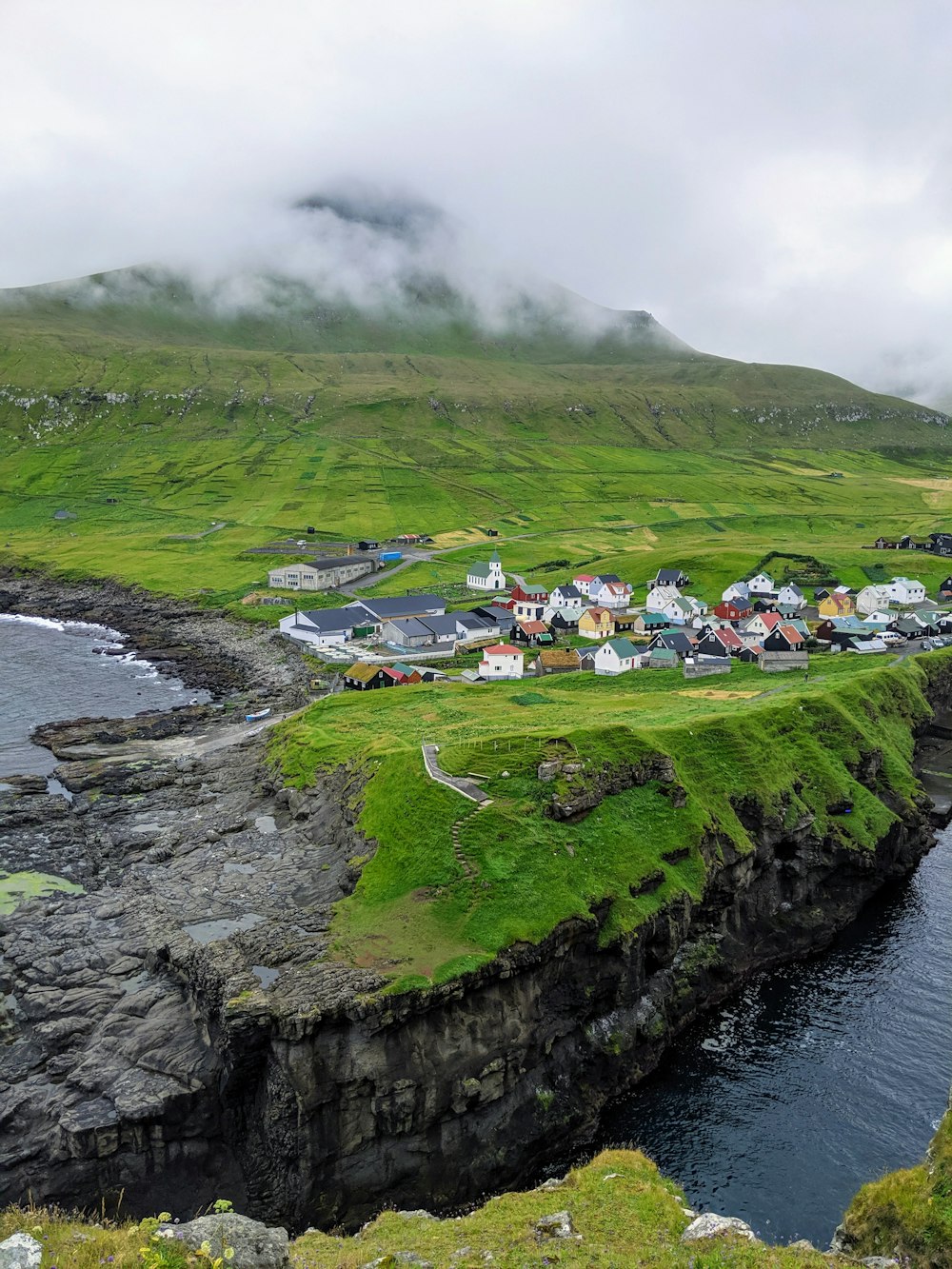 aerial view of houses near seashore