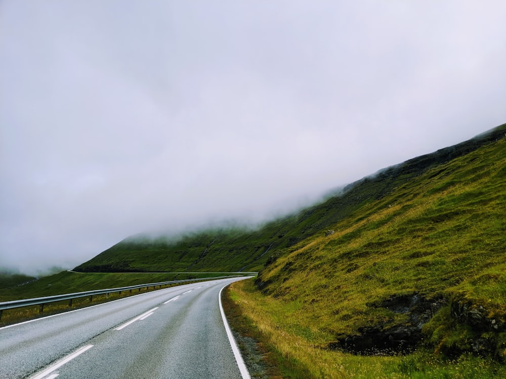 road near mountain during daytime