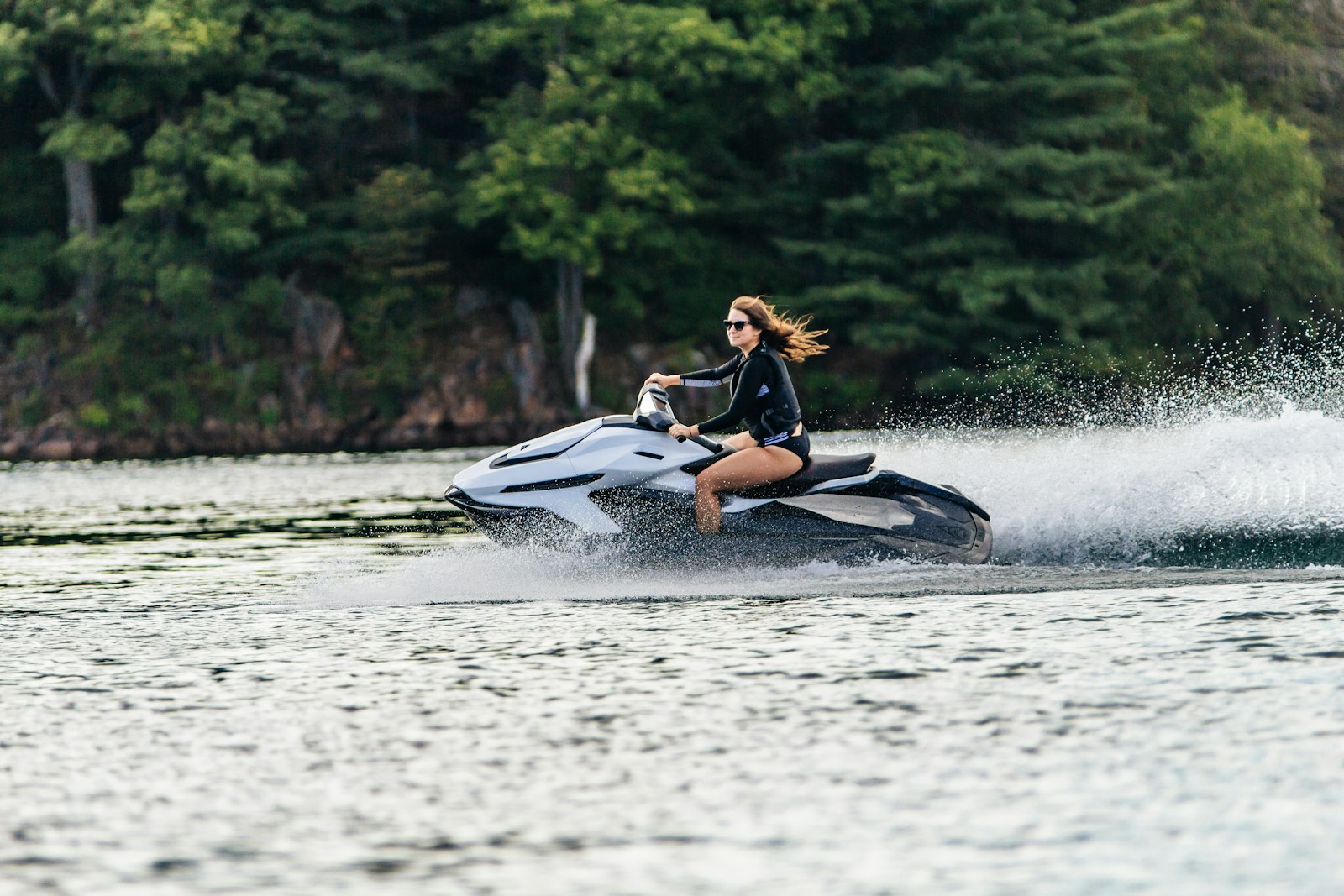 Sigma 70-200mm F2.8 EX DG OS HSM sample photo. Woman riding personal watercraft photography