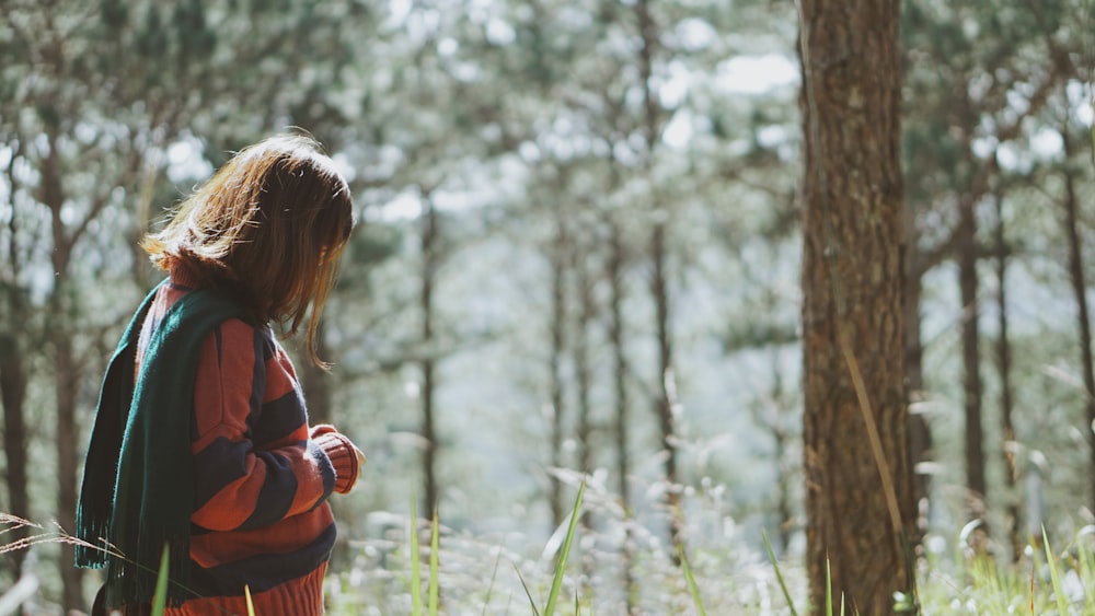 woman facing tree