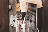 A collage of diverse photographs pinned on a board.