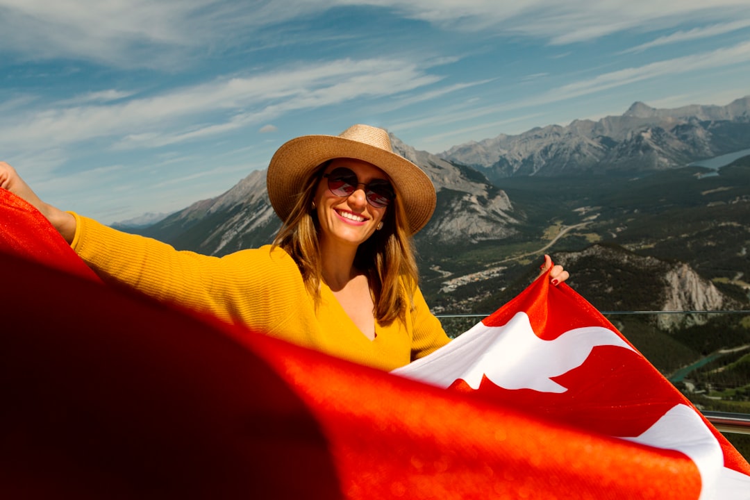 woman smiling and holding red textile