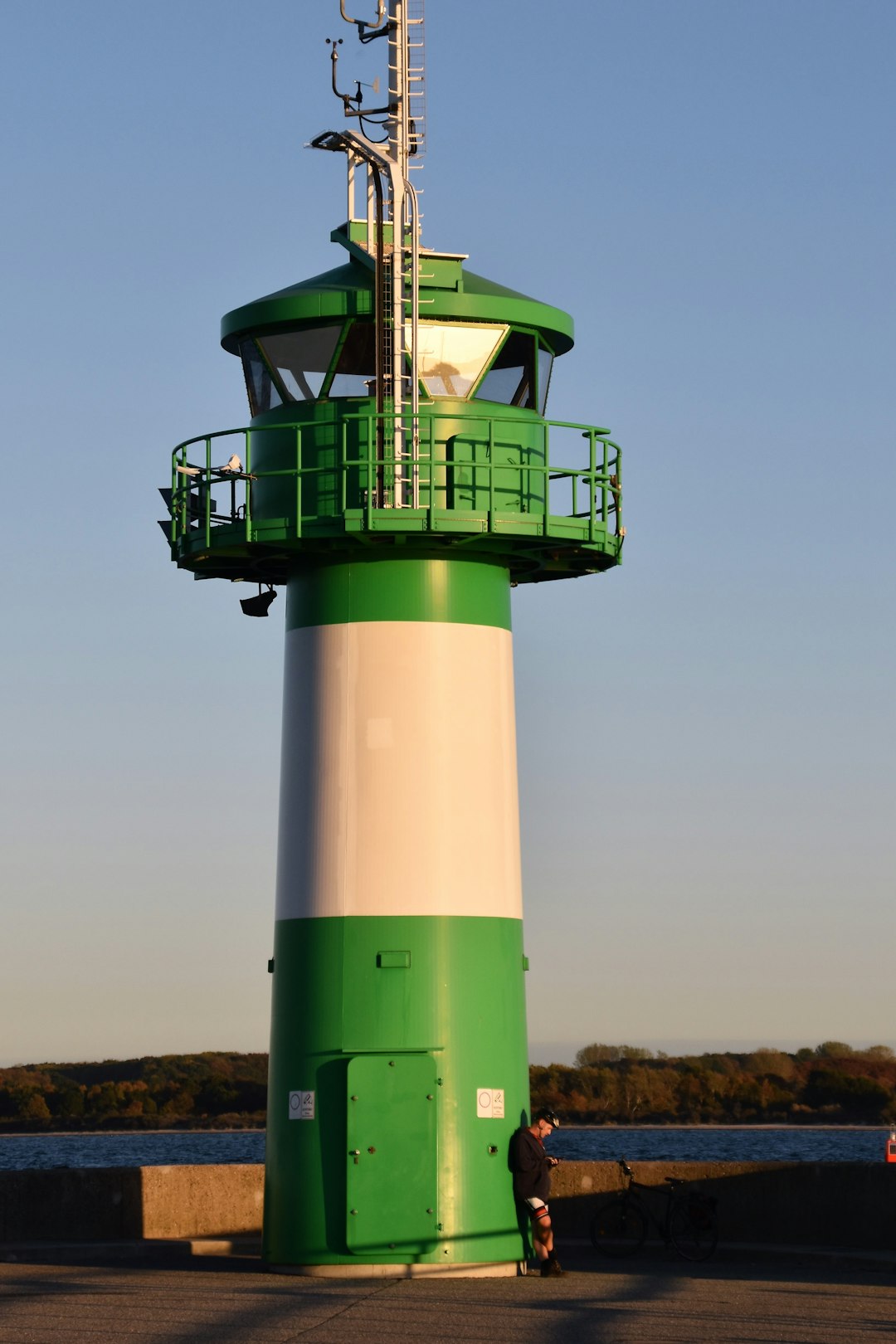 green and white concrete lighthouse