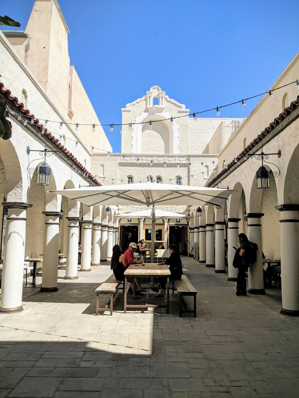 people sitting underneath parasol