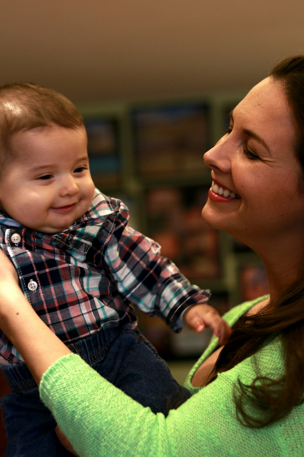 woman looking at baby