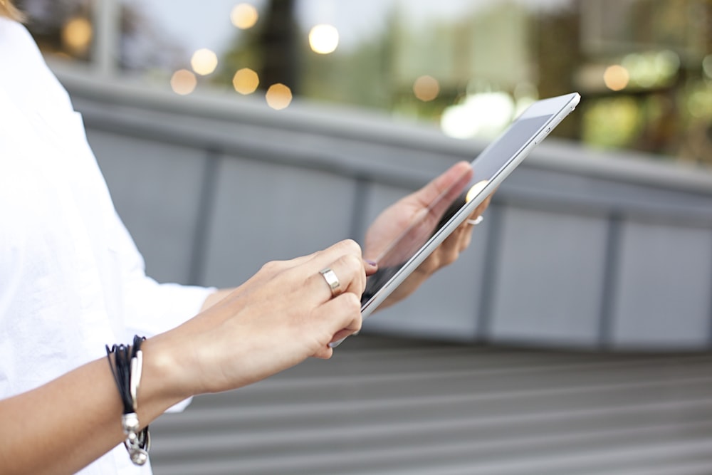 person holding iPad