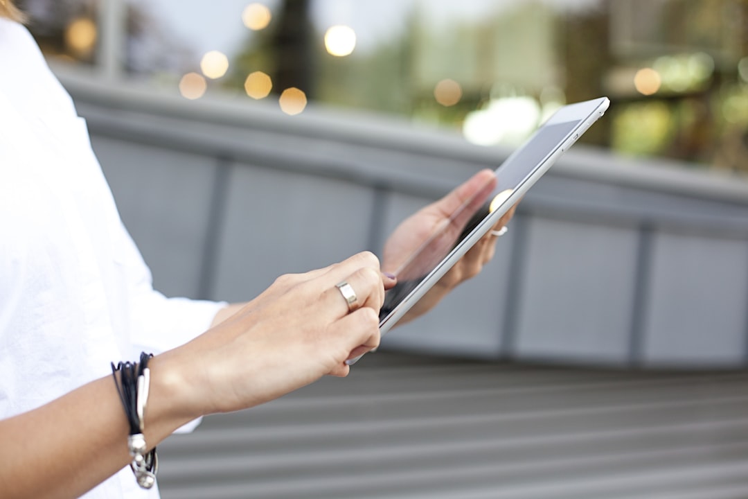person holding iPad,