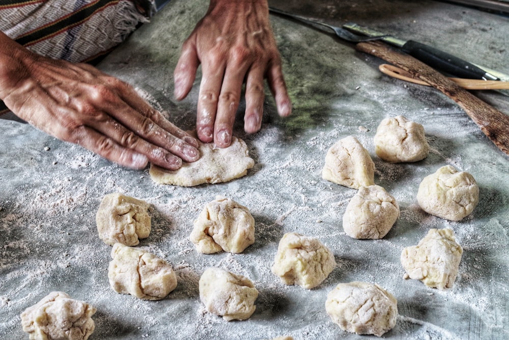 person molding flour