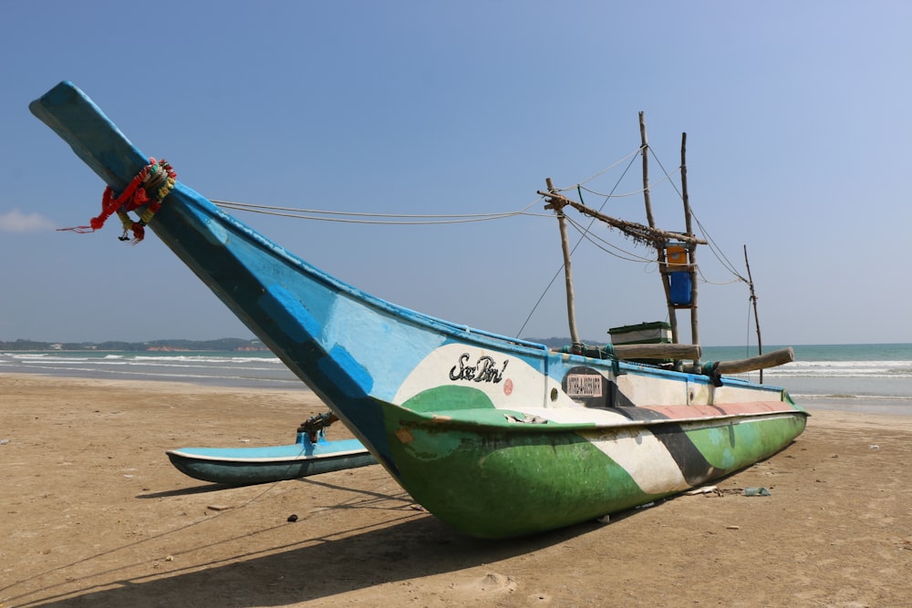 blue boat on seashore