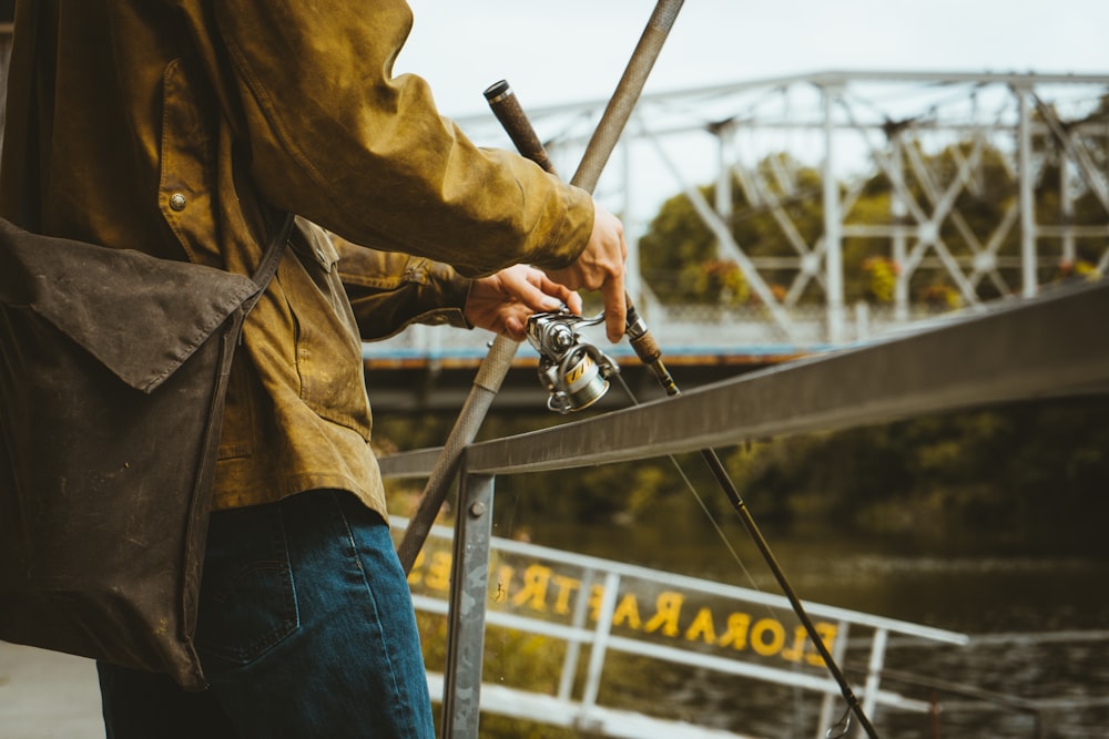 person holding fishing rod